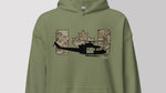 An olive green pullover hoodie featuring a graphic print of a black helicopter in front of a camouflage maple leaf and the letters 'HU' in a camouflage pattern, shown against a neutral gray background.