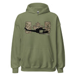 An olive green pullover hoodie with a graphic on the chest featuring a black helicopter silhouette, a camouflage maple leaf, and a camouflage Canadian flag background.