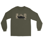 An olive green long-sleeve t-shirt with a graphic on the chest featuring a black tank silhouette, camouflage panels, and a maple leaf, displayed on a solid white background.